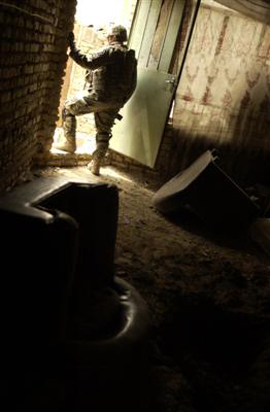 23rd Infantry Soldier Stands Guard At The Back Door Of A House In Rashid, Iraq