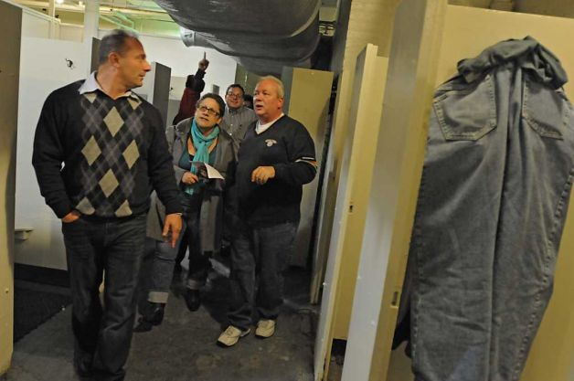 Members of the Albany Common Council and others walk through the mens locker room during a tour of the Public Bath No. 2 in Albany, NY on November 8, 2010. From left, John D'Antonio, Commissioner of Recreation, Susan Holland, Executive Director of Historic Albany Foundation, Dominick Calsolaro, Albany Common Council member, and John Lasch, Facility Supervisor for the City of Albany. The public bath is slated for closure under Mayor Jerry Jennings proposed 2011 budget. (Lori Van Buren / Times Union)
