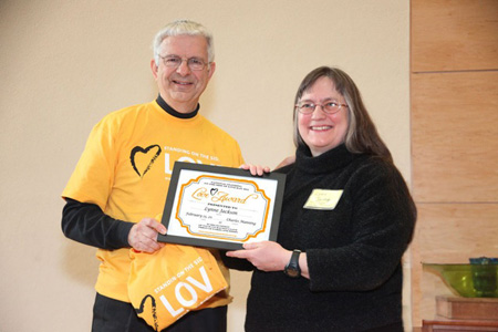 FUUSA Board President Chuck Manning Presents The Wife With The Standing On The Side Of Love Award... And A T-shirt