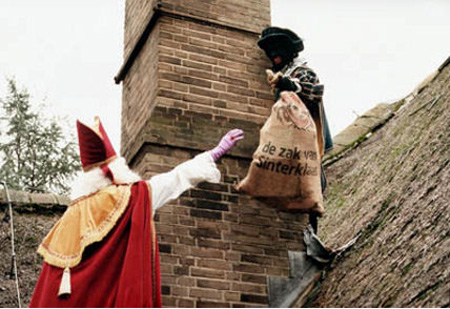 Black Pete Works While The Bishop Supervises