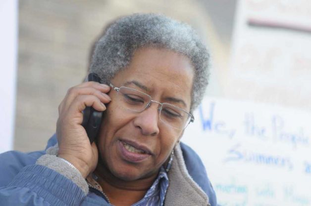 Jacqui Williams, a community organizer and resident of Albany's South End, talks on the phone with a representative from Mayor Jerry Jennings' office during a rally at the City's Public Bath No. 2 on Thursday. (Paul Buckowski / Times Union (Paul Buckowski)  Read more: http://www.timesunion.com/local/article/Pool-fans-make-splash-on-last-day-928525.php#ixzz1Ah8l8QW5