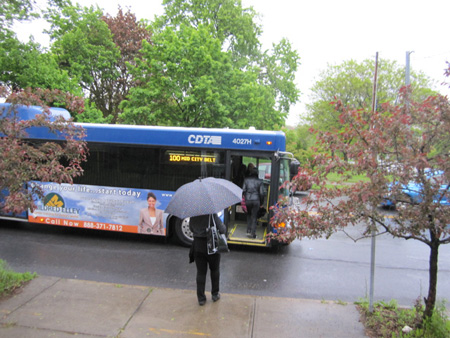 Commuters Catch The 100 Bus On A Rainy Morning In May, Morton Avenue
