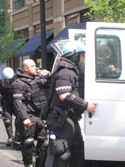 Riot Cops At White Vans Dressing In Armor
